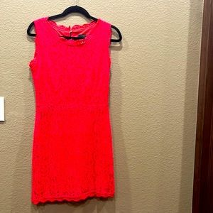 Red lace dress with bow accents on back